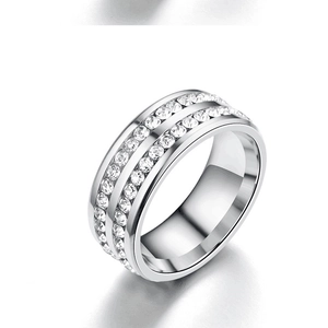 Close-up of sparkling double-row diamond settings on a polished silver stainless steel ring