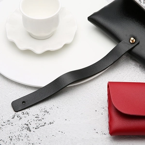 Litchi pattern leather sunglasses case set in black and red with gold metal button