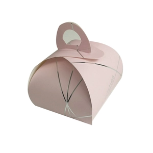 Pink cardboard gift box with silver geometric lines, heart handle, and wishes text