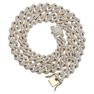 Detail of gold Cuban link chain with full cubic zirconia stones and secure box clasp