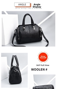 Detail of black textured leather boston handbag with adjustable strap and silver hardware