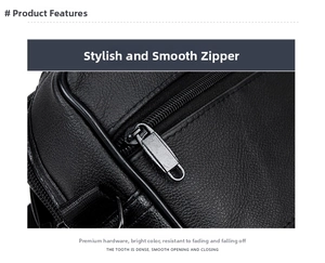 Close-up of a smooth metal zipper on a black leather business bag with natural texture