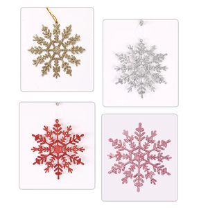 Close-up of 12cm glittery snowflake ornaments in gold, silver, red, and pink colors