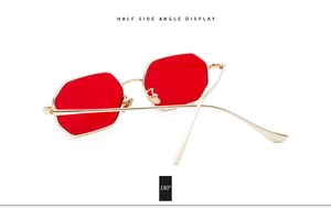 Side angle view of trendy rectangle sunglasses with gold metal frame and red lenses