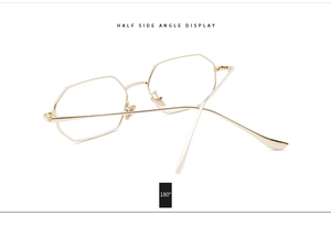 Detail of gold rectangular metal frame showing 180-degree flexible hinge structure