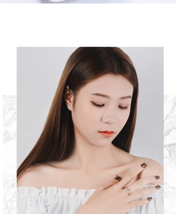 Silver celestial ring featuring moon and star details worn by a model on the index finger