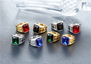 Detailed display of punk cross rings with square gemstones in gold and silver steel finish
