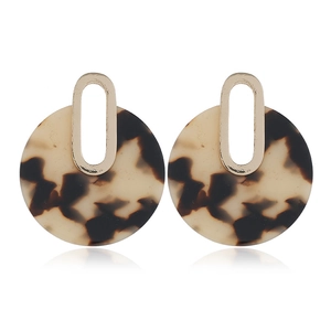Detail of leopard print acrylic hoop earrings with golden U-shaped metal studs
