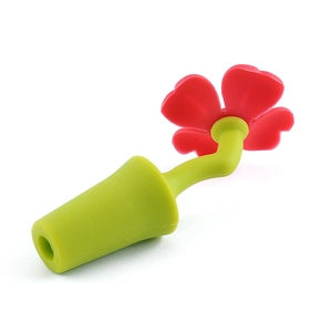 Creative red flower silicone wine bottle stopper with green stem on white background