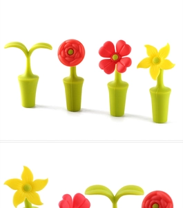 Detail view of silicone wine stoppers with colorful floral and sprout designs