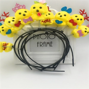 Close-up of yellow foam chick headbands with glitter bow and spring detail for party decoration