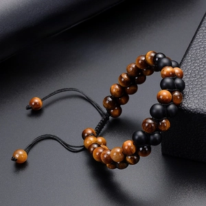 Detail of 8mm tiger eye and black onyx double row healing stone bracelet with woven cord