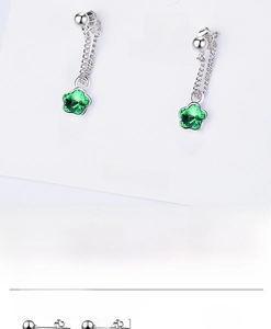 Detail of silver drop earrings featuring 4mm green crystal flowers and chain links
