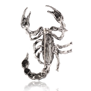 Detailed back view of vintage scorpion brooch showing the safety pin fastener mechanism