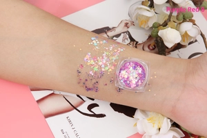 Magenta 8 glitter gel swatch on skin with holographic stars and hexagons for face and body