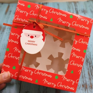 Red 4-slot Christmas cupcake box with transparent window and festive ribbon decoration