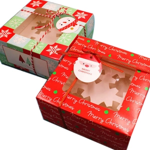 Christmas cupcake gift boxes with transparent windows and festive Santa Claus gift tags