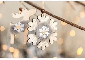 Macro detail of wooden reindeer and snowflake ornaments with soft grey faux fur texture