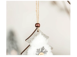 Close-up of wooden Christmas tree ornament with faux fur, snowflake and button detail