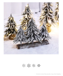 Mini cedar snow-dusted Christmas trees on natural wood base with warm LED lights