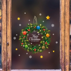 Christmas wreath window sticker with Merry Christmas text on rustic wooden glass pane