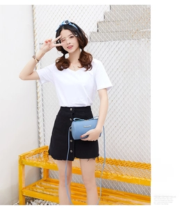 Close-up of light blue lychee pattern leather crossbody bag with golden logo and zipper