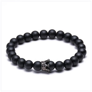 Detail of matte black lava stone beads with a micro-pave zircon crown charm