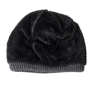 Close-up of winter knit beanie showing soft thick black fleece lining for warmth