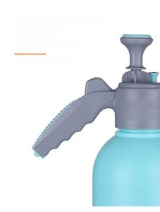 Close-up of ergonomic pressure sprayer handle with thumb-operated easy press lever