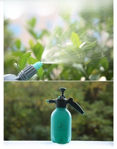 Close-up of the adjustable nozzle showing a fine mist spray for garden plant care