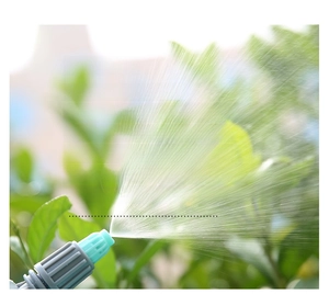 Close-up of the garden sprayer nozzle spraying fine water mist for plants