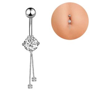 Close-up of silver belly ring with zircon stone and elegant dangling tassel chains