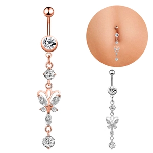 Macro detail of butterfly belly button ring with zircon stones in rose gold and silver