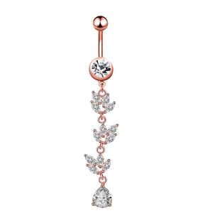 Detailed view of rose gold belly ring with sparkling zircon leaf tassels and pear pendant