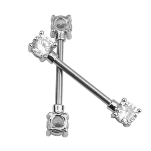 Detailed view of silver barbells with sparkling white cubic zirconia stones for piercings