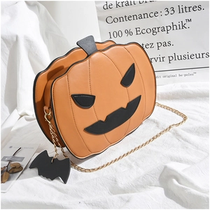 Detail view of pumpkin-shaped PU leather bag with chain strap and bat pendant