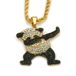 Close-up of golden dabbing panda pendant with sparkling crystal rhinestones and twisted chain