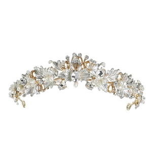Detailed view of bridal crown featuring golden leaves, sparkling crystals and white pearls