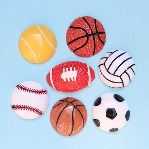 Assorted large resin sports ball flatback charms including soccer, basketball, and tennis