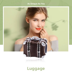 Detail of vintage brown enamel suitcase charm with silver accents for DIY bracelets
