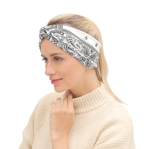 Detail of white wide-knot headband featuring black paisley print on a female model