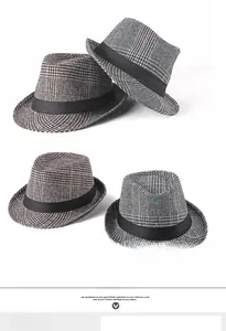 Close-up of British style plaid jazz fedora hat with black decorative silk band detail