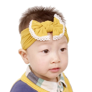 Comfortable soft nylon baby headband with mustard yellow bow and white lace trim design