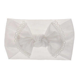 Close-up of a white soft nylon baby headband featuring a delicate lace bow detail.