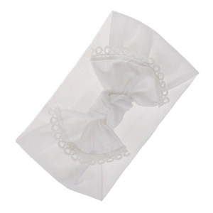 Soft white nylon baby headband with a large lace-edged bow detail for infants