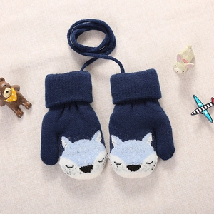 Detail of blue knitted toddler gloves with fox pattern and anti-lost connection string