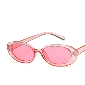 Retro translucent pink oval sunglasses with lightweight frame in vintage Y2K style