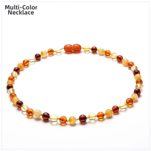 Detail of natural Baltic amber beads necklace with secure orange screw clasp closure