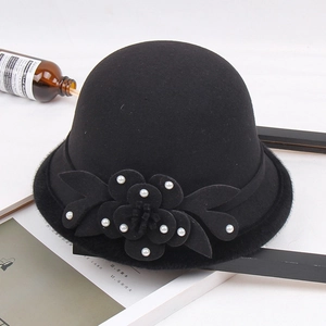 Elegant black wool cloche hat for women with floral accents and pearls for autumn and winter