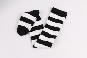Flat lay view of classic black and white striped over-the-knee socks for cosplay